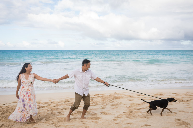 fun engagement session at the beach, ©VIVIDFotos | dog-friendly engagement photos, Waimanalo, Hawaii