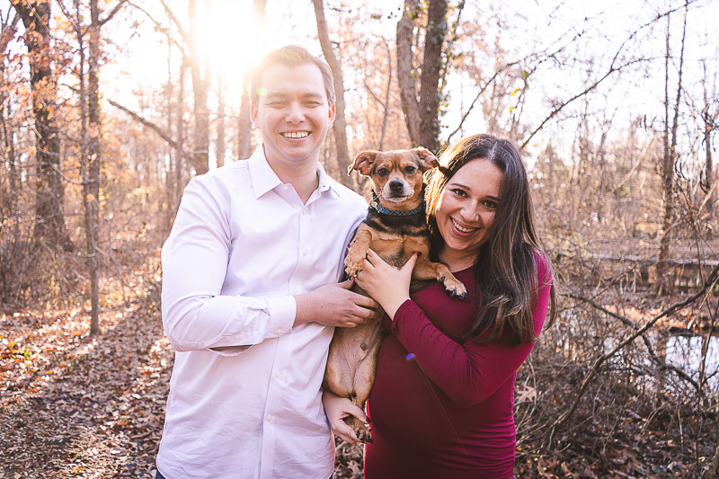 late fall maternity session, St. Louis, couple holding their mixed breed dog | ©Aim With Mia Photography