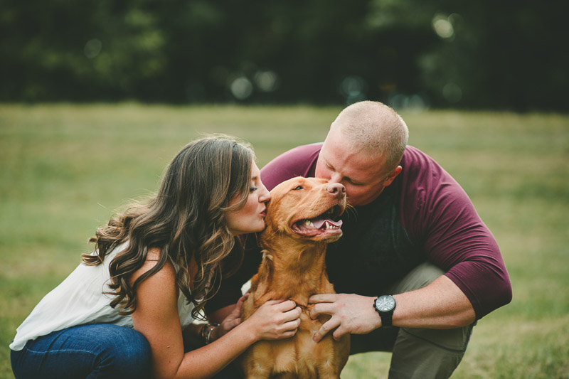couple kissing their dog, dog-friendly engagement session | ©Kate Spencer Photography