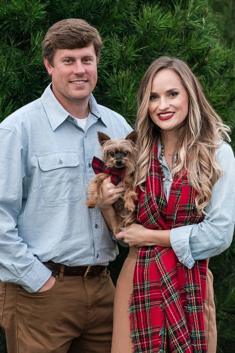 Yorkie wearing plaid bow and couple, holiday pictures with a dog, ©Candice Brown Photography