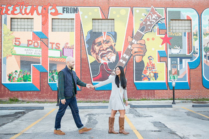 urban engagement session, ©Jessica Hunt Photography. couple walking in front of 5 Points mural