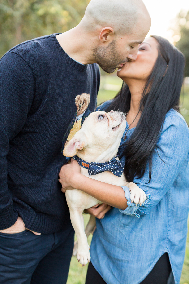 French Bulldog looking at woman as she kisses her fiance, dog-friendly engagement session | ©Jessica Hunt Photography. Columbia, SC