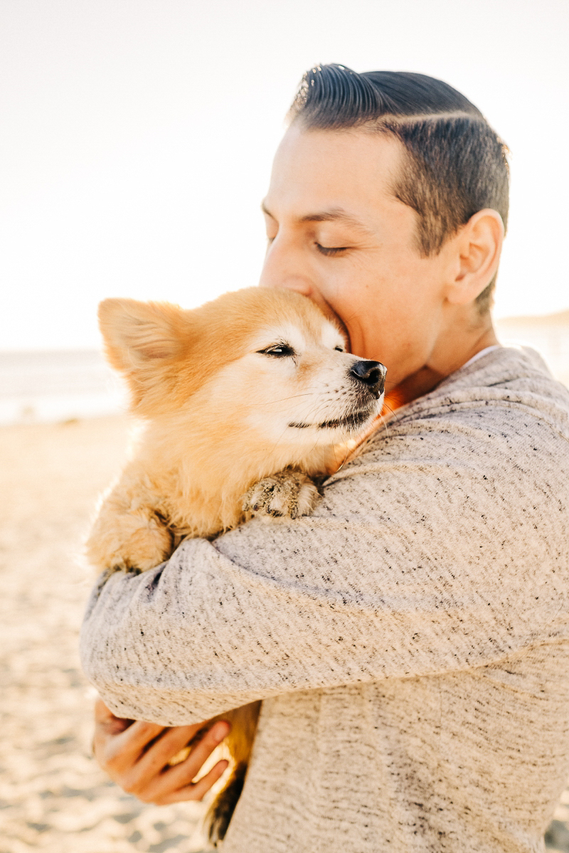 man's best friend, man holding Corgi mix, lifestyle dog photography | ©misterdebs photography