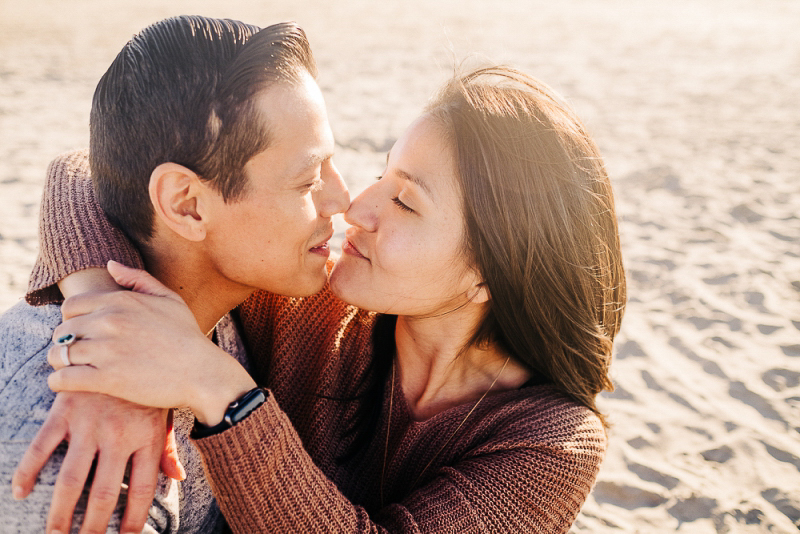 couple embracing at the beach, romantic engagement photos | ©misterdebs photography, San Diego