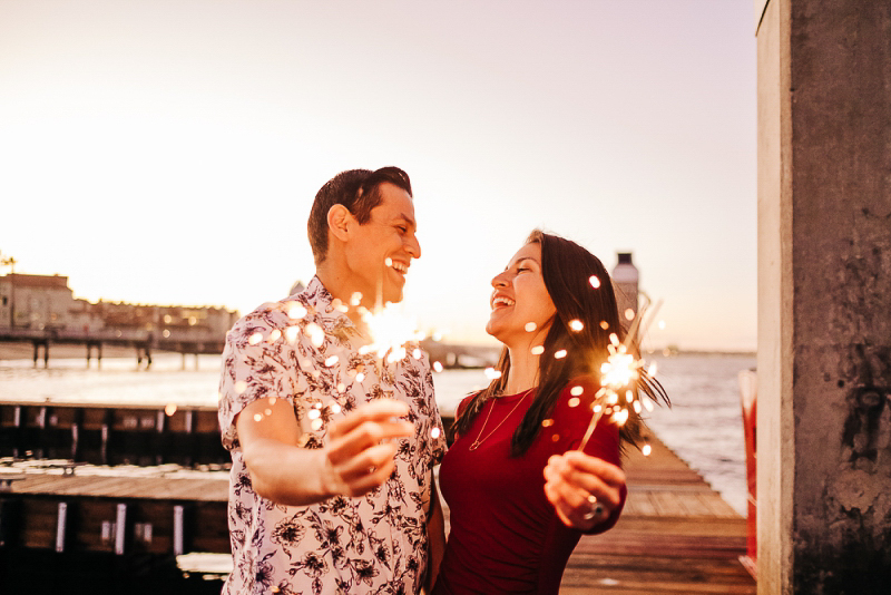 couple holding sparklers | ©misterdebs photography lifestyle San Diego engagement session