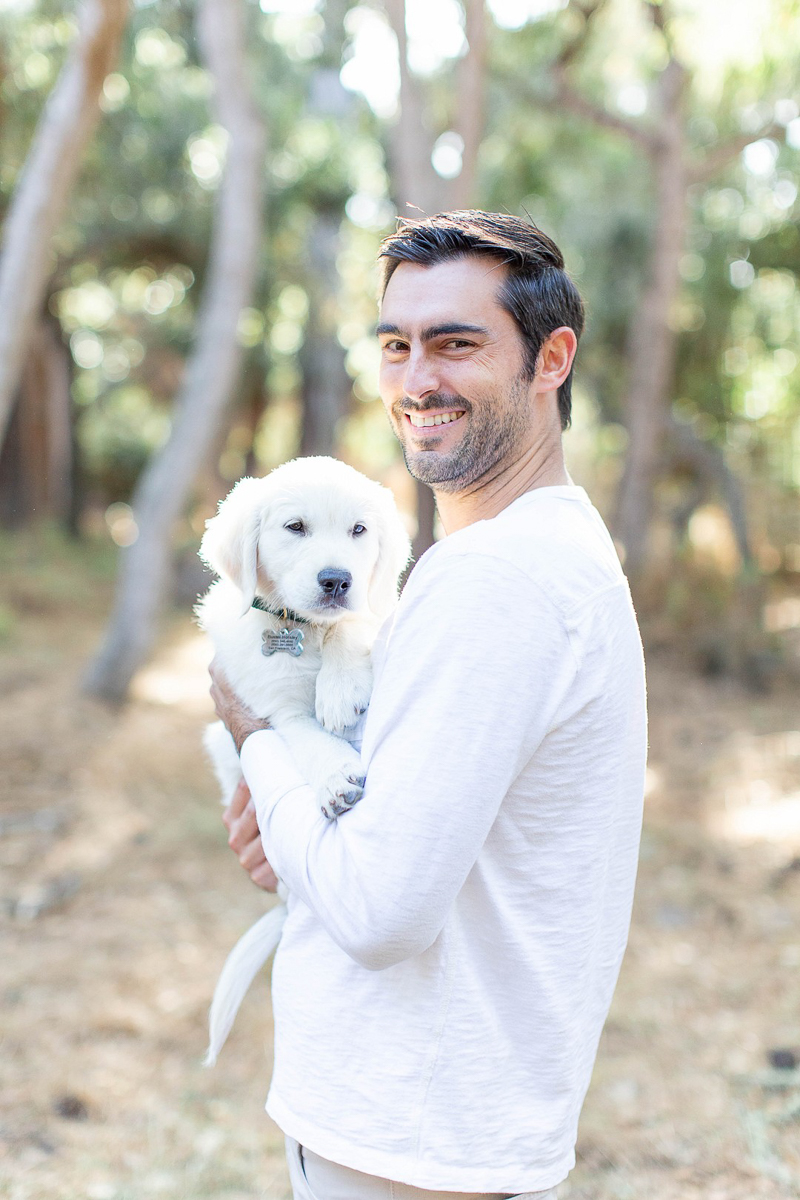 man holding Golden Retriever puppy | ©Laura & Rachel Photography