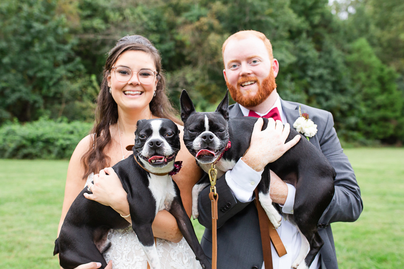 bride and groom holding Boston Terriers | ©Megan Rei Photography, Richmond, VA
