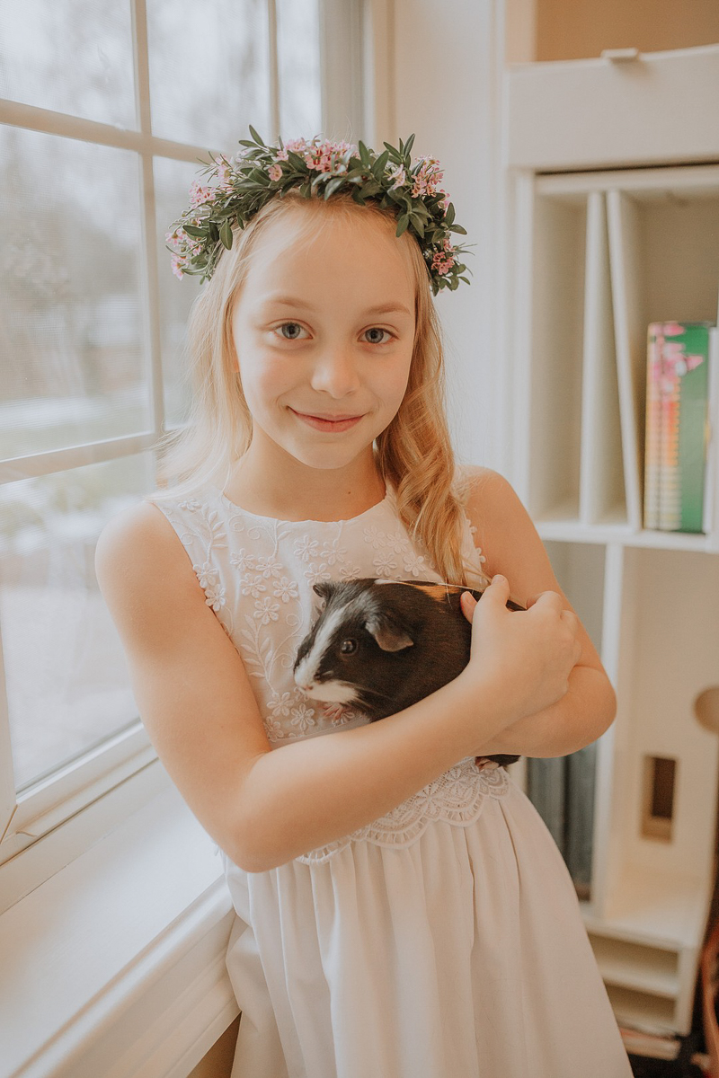 Pet-friendly First Communion Session, girl holding guinea pig | ©Gardenhouse FIlms | Albany, NY