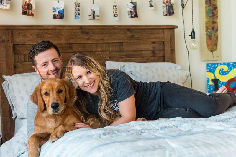 couple and their dog on the bed. ©Alice G Patterson Photography - Syracuse dog photography, Golden Retriever