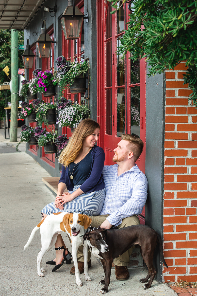 couple outside building with their hound mixes |