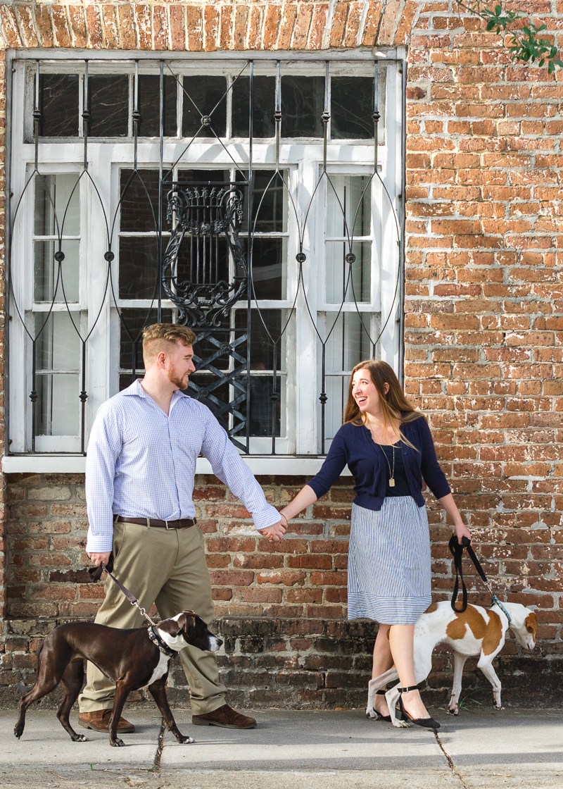couple holding hands and walking their dogs, | Charleston Photo Art