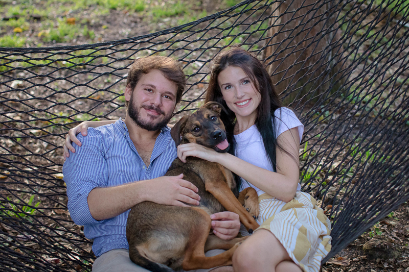 happy couple and their dog on hammock, pet-friendly family portraits | ©Impressions Photography