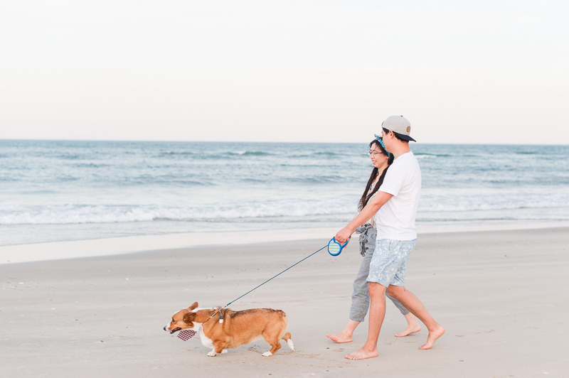 couple walking their dog on the beach | ©Michelle & Sara Photography | Outer Banks, NC