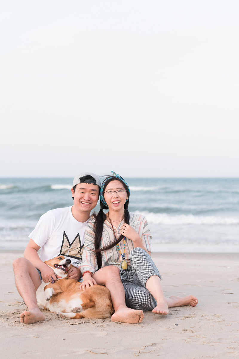 cute Corgi and his humans on the beach, Outer Banks, NC | ©Michelle & Sara Photography