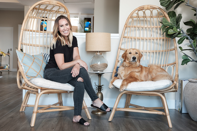 woman and her dog on egg chairs | in-home lifestyle dog photography ©Nicole Caldwell Photo