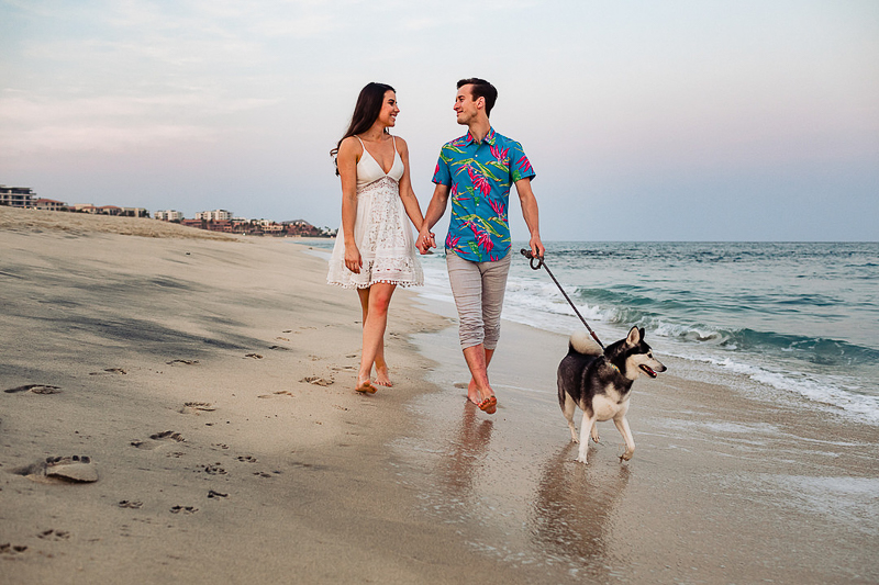couple and their dog walking on the beach, ©Fabi Rosas Photography, dog-friendly engagement session Cabo, Mexico