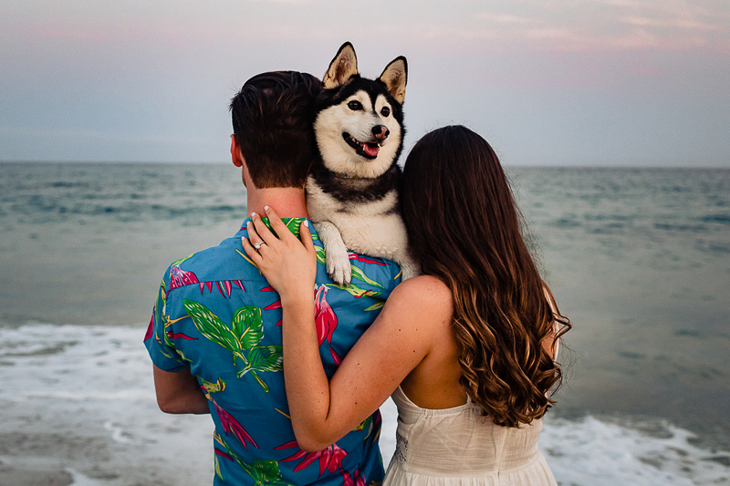 happy dog looking over humans' shoulders | ©Fabi Rosas Photography, dog-friendly beach engagement session Cabo, Mexico