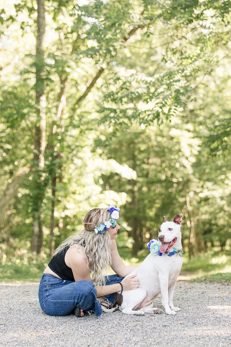 a girl and her dog sitting on gravel path, on location pet portraits | ©Limelight Entertainment 