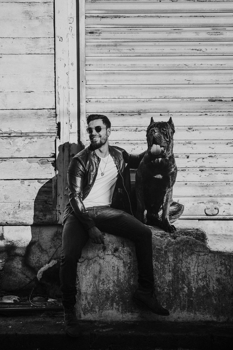 man and his dog, Cane Corso and man sitting on concrete, Cedric D Vincent Photography | Mauritius fashion photographer