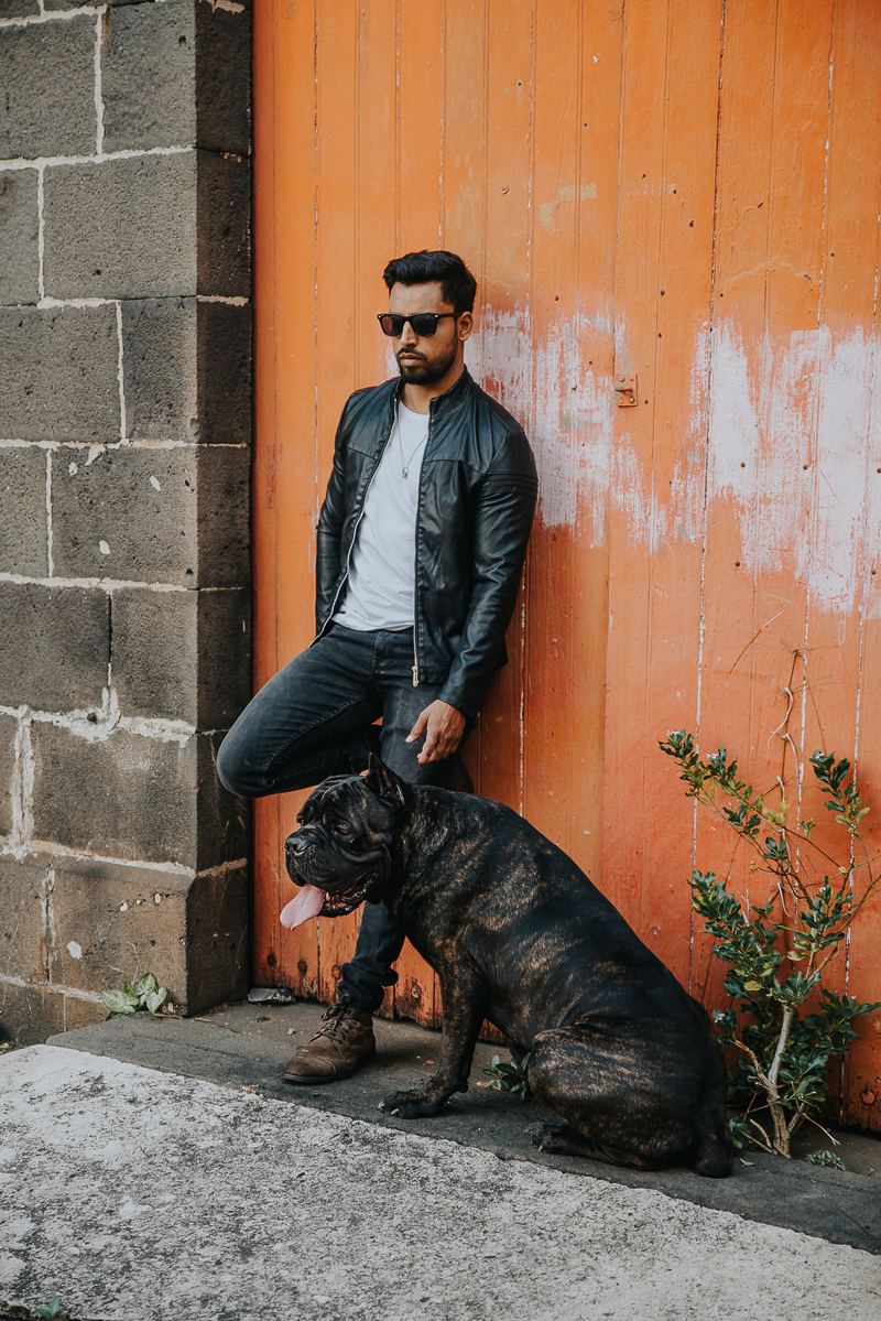 man and dog leaning against orange garage doors | Cedric D Vincent Photography | Mauritius lifestyle photographer