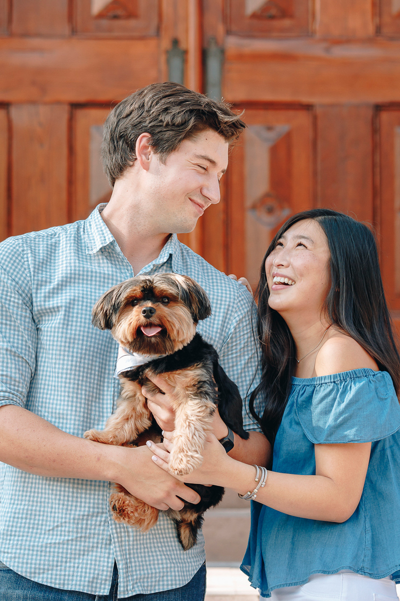 engagement portraits with a dog, small dog photography poses, ©Charleston Photo Art