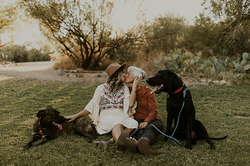women kissing, dogs sitting next to them, dog-friendly engagement session | ©Kali M Photos | 