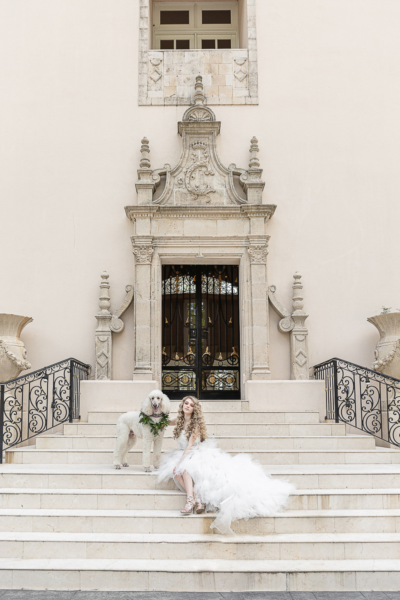 bride and dog outside Chateau Cocomar, Houston, TX | ©C. Baron Photography