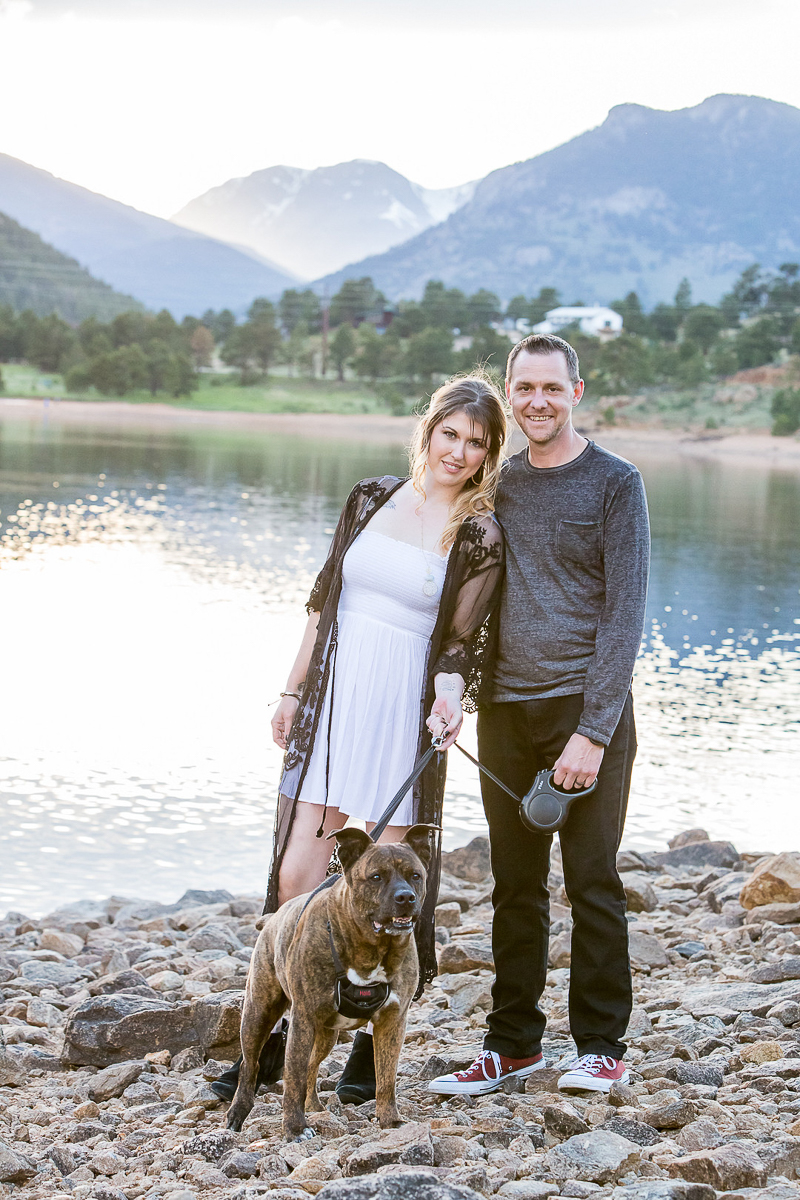 couple and their dog at lake, mountains in background | © Nichole Emerson Photography | Allenspark, Colorado