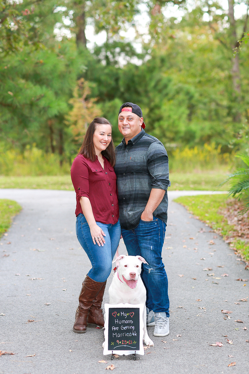 dog sitting behind save the date sign, ©Fresh Look Photography dog-friendly Virginia Beach engagement session
