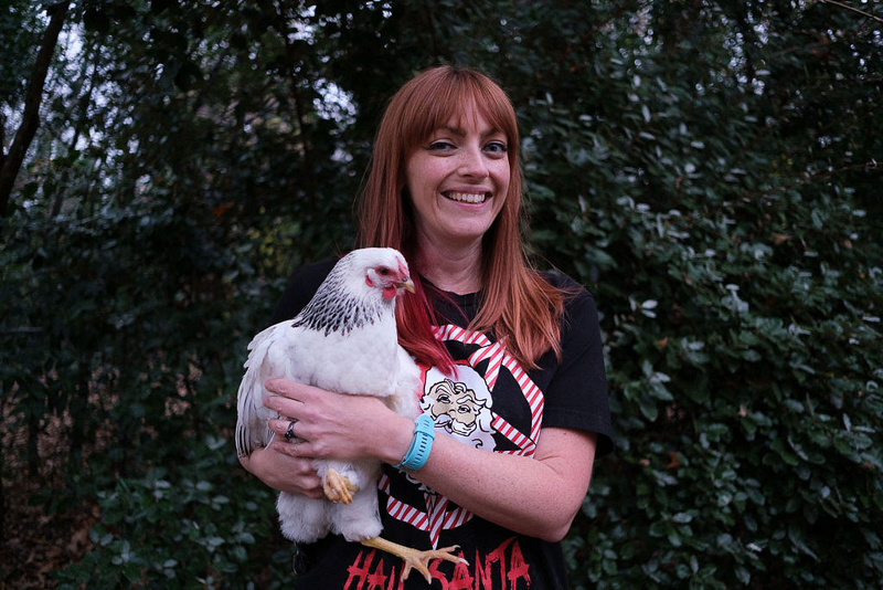 woman holding white chicken | © Hallie Sigwing Photography, family portraits