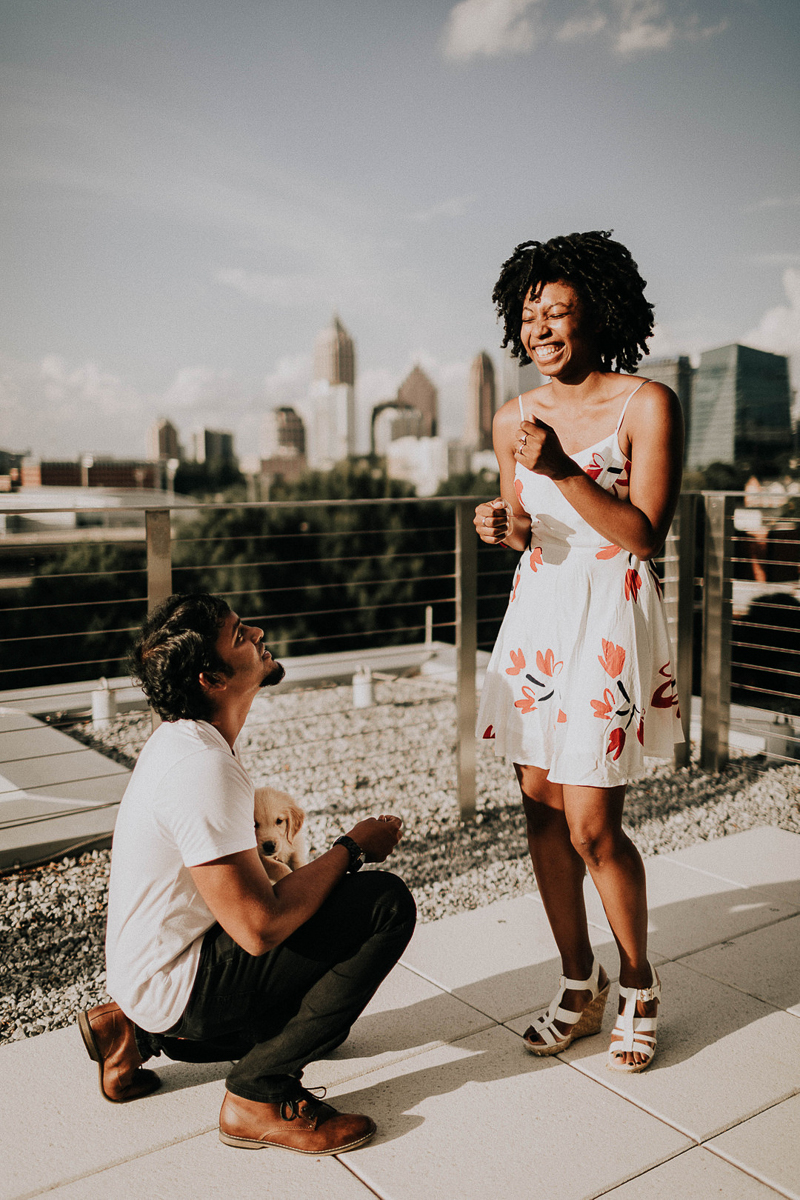 man on one knee with puppy proposing to young woman, ©Sheena Shahangian Photography