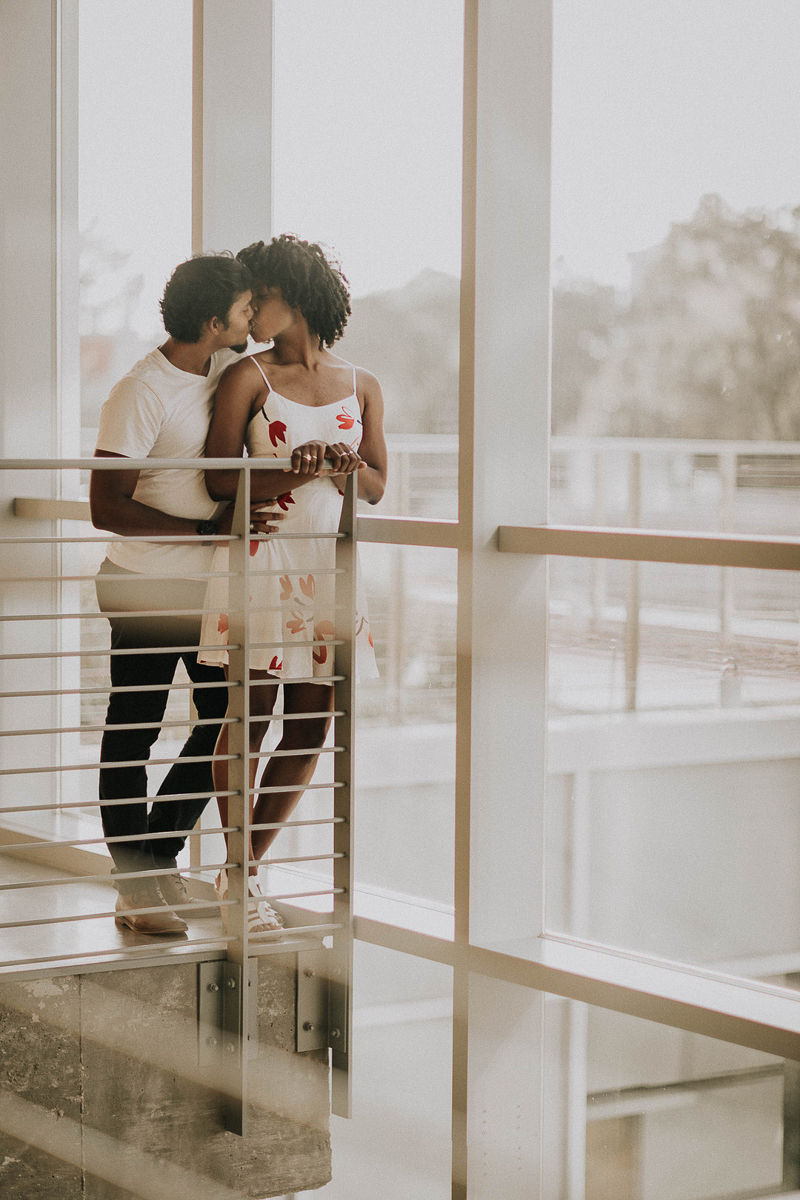 couple kissing while leaning against railing | ©Sheena Shahangian Photography, Georgia Tech