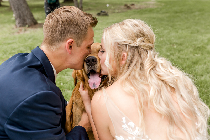 bride and groom kissing their pup, dogs in wedding pictures | ©Alexandra Robyn Photo + Design