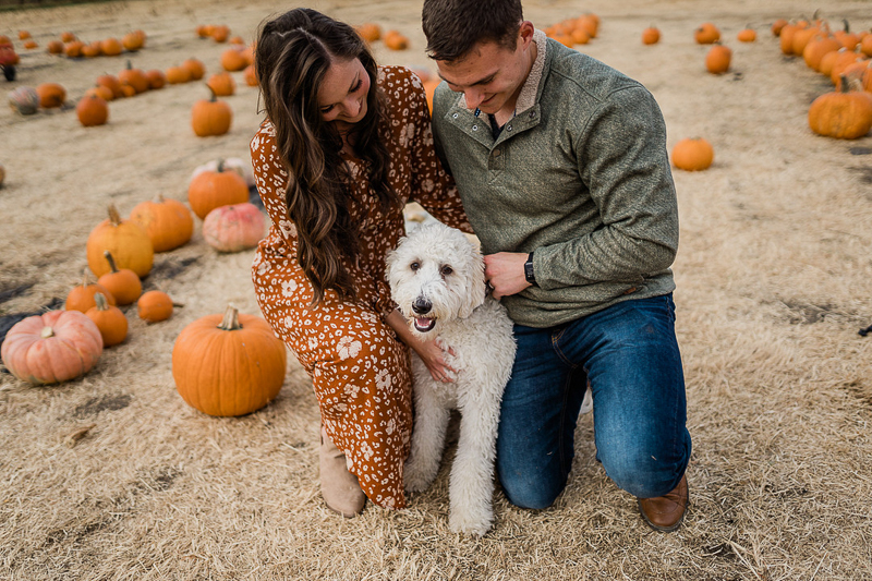 fall photo ideas, couple and their dog in pumpkin patch | ©Erica Jane Photography | Sioux Falls, SD