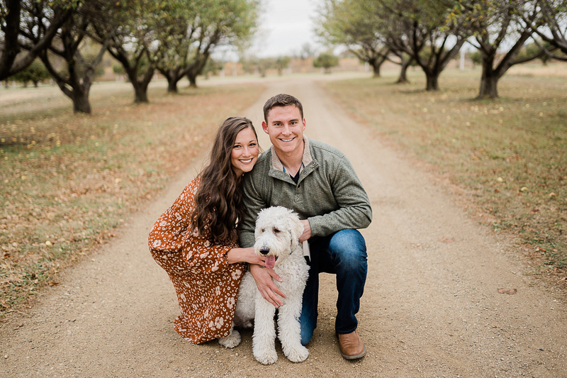 lifestyle fall family photos with a Goldendoodle | ©Erica Jane Photography