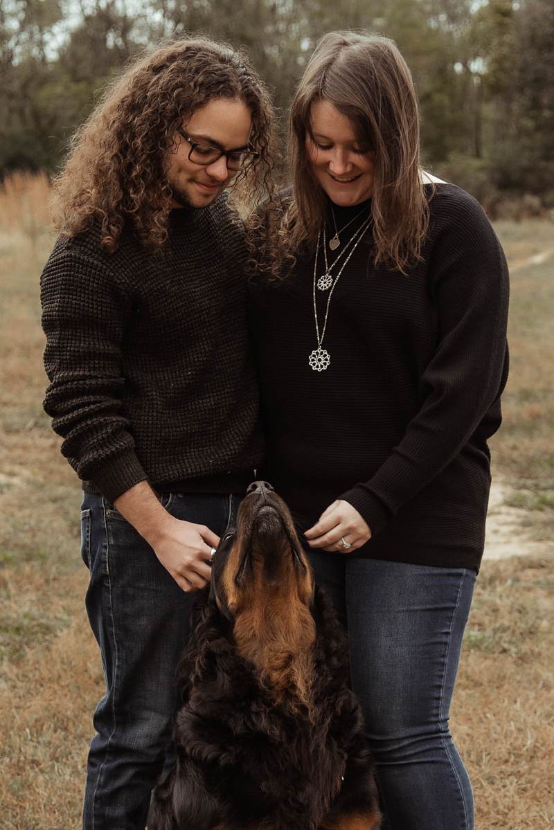 couple looking down at their dog, dog looking up at couple, ©Emily Swan Photography | engagement photography, Memphis. TN