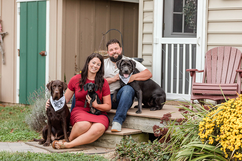 engagement photos with dogs on porch steps, ©Fox Photography LLC