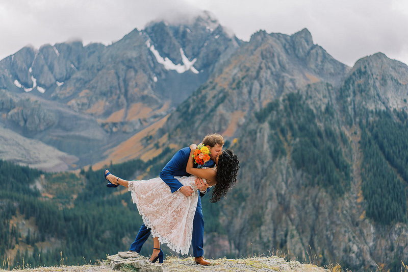 first kiss, Colorado elopement, mountains in background | ©Shell Creek Photography
