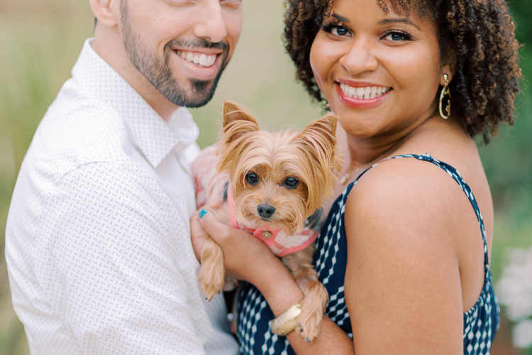 couple holding their Yorkie, dog-friendly engagement | ©Terrie Images