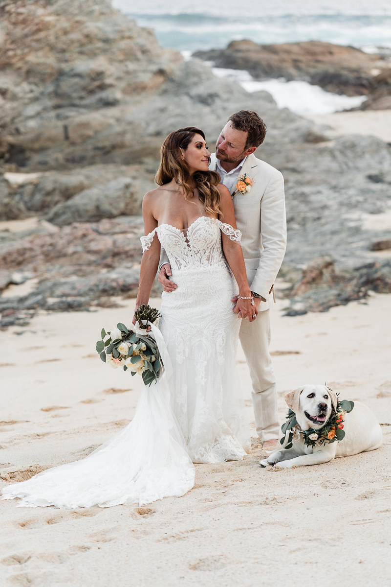 bride and groom on the beach with their Labrador Retriever, dog-friendly destination wedding | ©Fabi Rosas Photography