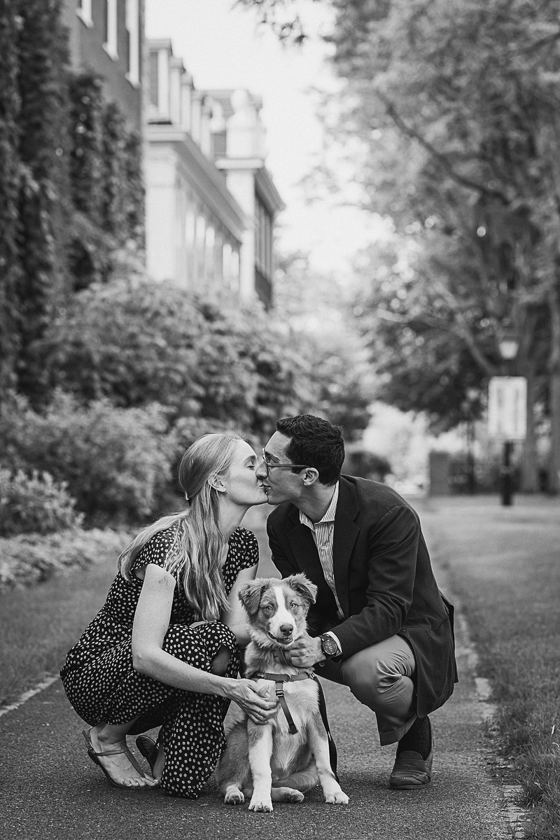 couple kneeling down behind their Toller puppy, tips for photographing dogs and people | © CityLux Studios