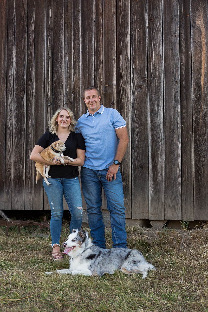 couple and their dogs in front of barn | ©Photography by Cambrae