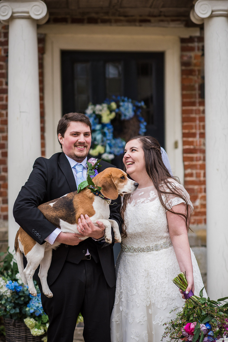 bride and groom and their dog outside of Westenhanger Castle, Kent, UK, ©fleur challis photography