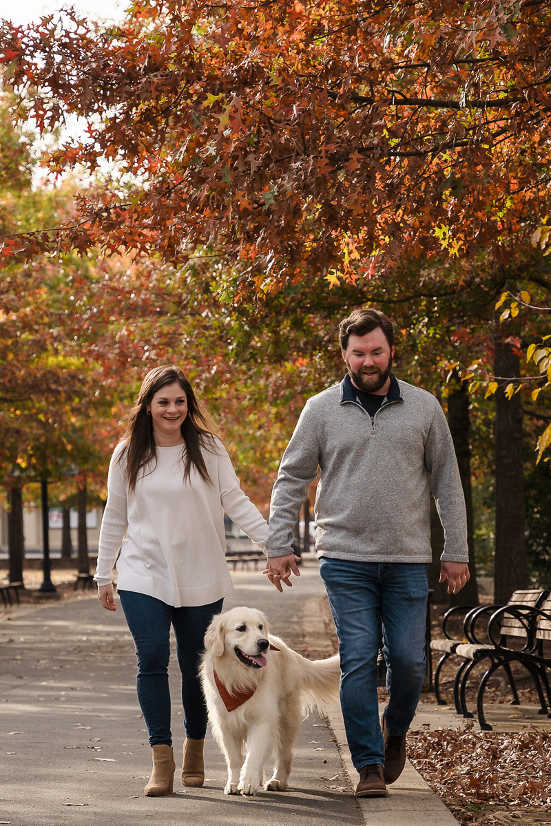 couple with English Cream Golden Retriever wearing rust bandana walking | ©Party of Two Photography