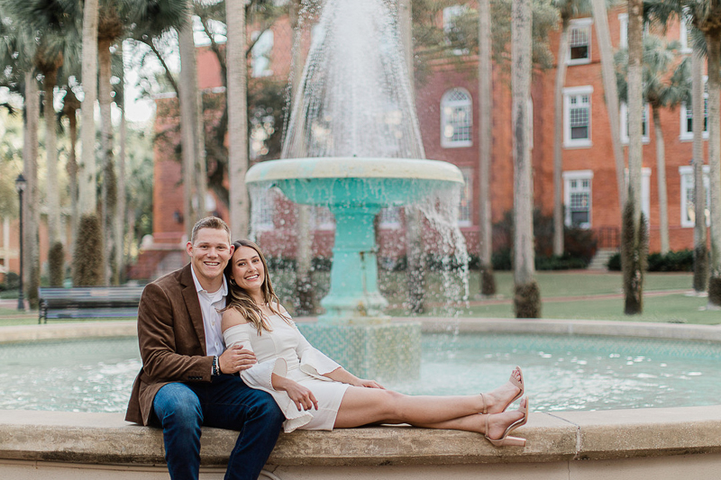 couple sitting on fountain, Stetson University | ©Willow & Oak Photography Grad session