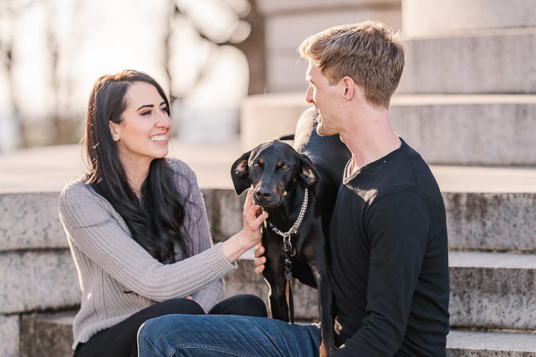 couple sitting on steps with Black & Tan Coonhound mix, dog-friendly engagement photo ideas ©Sarah Larae Photography