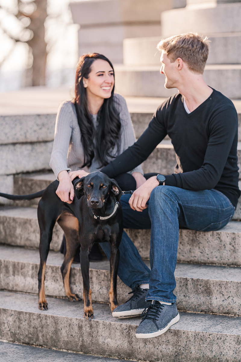 couple sitting on steps with Black & Tan Coonhound mix, dog-friendly engagement photo ideas ©Sarah Larae Photography