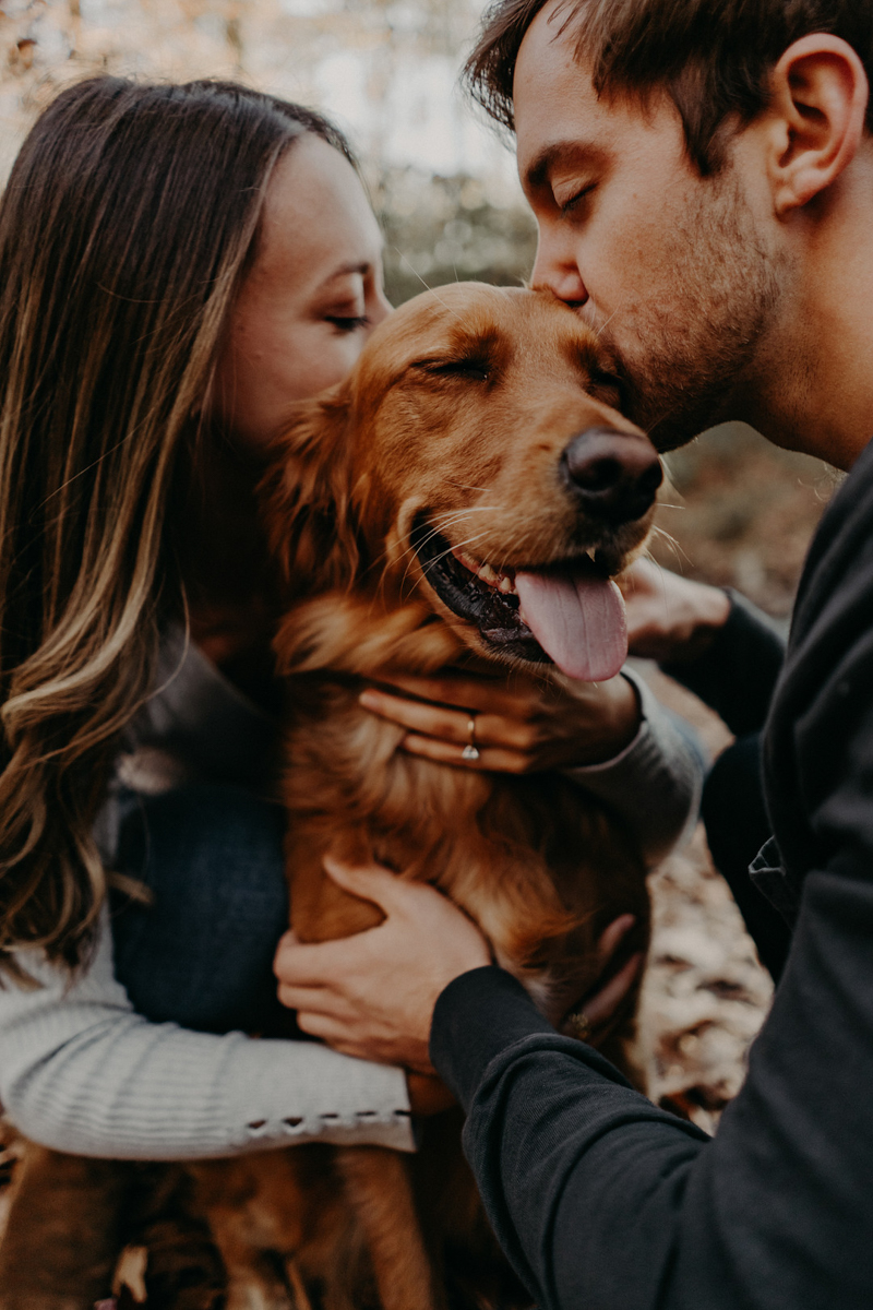 couple kissing their dog, outdoor engagement photos, Roswell, GA | winter engagement photos with a dog, ©Nathalia Frykman Photography
