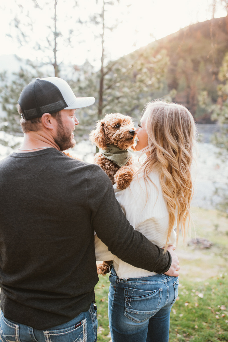 including dog in engagement photos | ©Courtney Kammers Photography couple holding cute pup , Lenore, ID