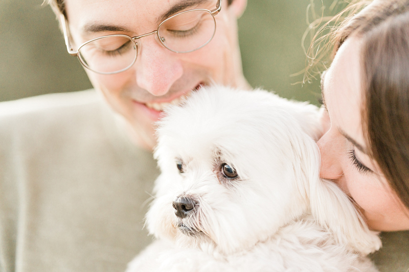 couple looking at their Maltese-Shih Tzu mix ©Mel Schroeder Photography